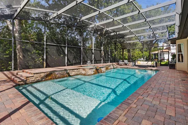 a view of a swimming pool with a backyard