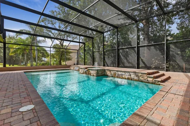 a bed room with a bed and a ceiling fan