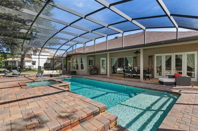 a view of a backyard with sitting area