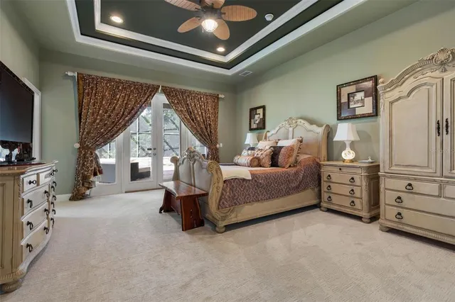 a spacious bathroom with a tub sink and mirror