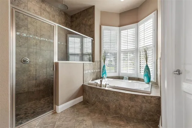 a living room with furniture a fireplace and a chandelier