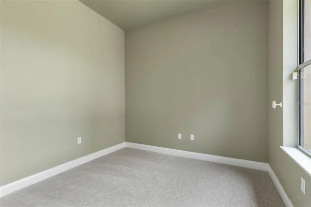 a view of a dining room with furniture a chandelier and wooden floor