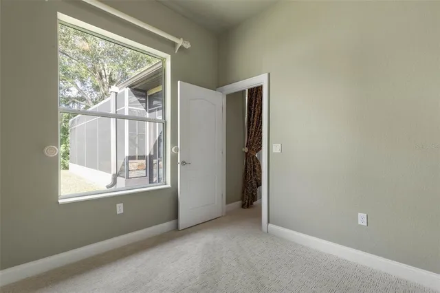 a view of a dining room with furniture and a chandelier