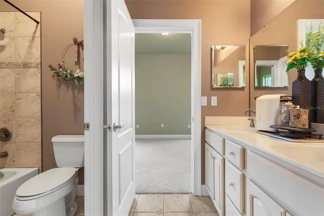 an aerial view of a house with garden space and street view