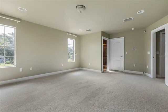 an aerial view of a house with outdoor space