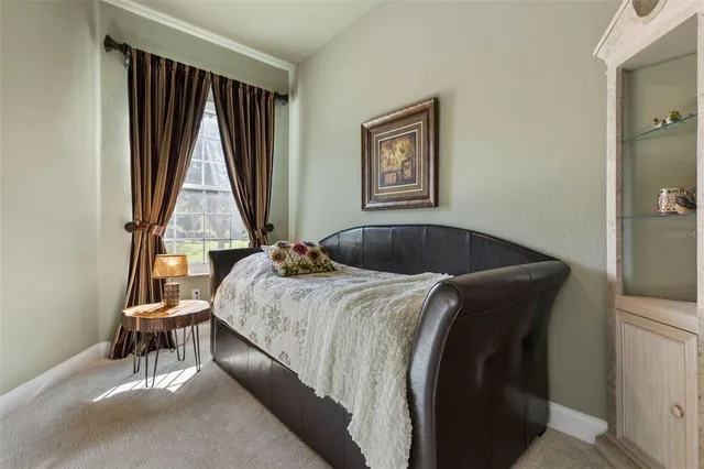 a view of backyard with deck and outdoor seating