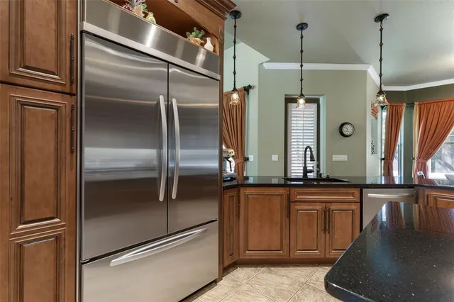 a kitchen with stainless steel appliances granite countertop a stove and a sink
