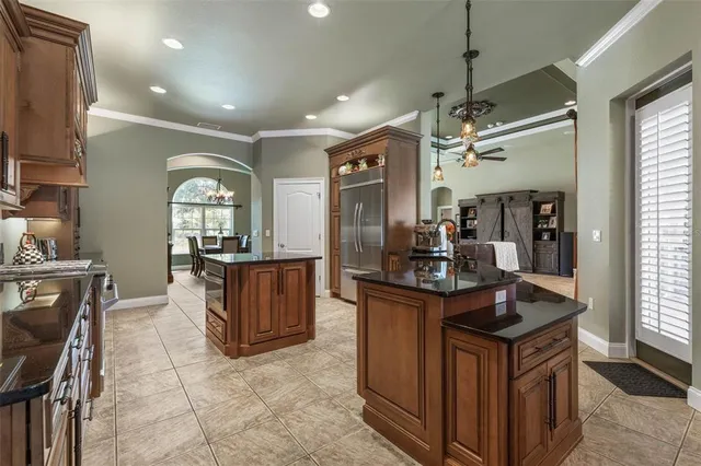 a stove top oven sitting inside of a kitchen