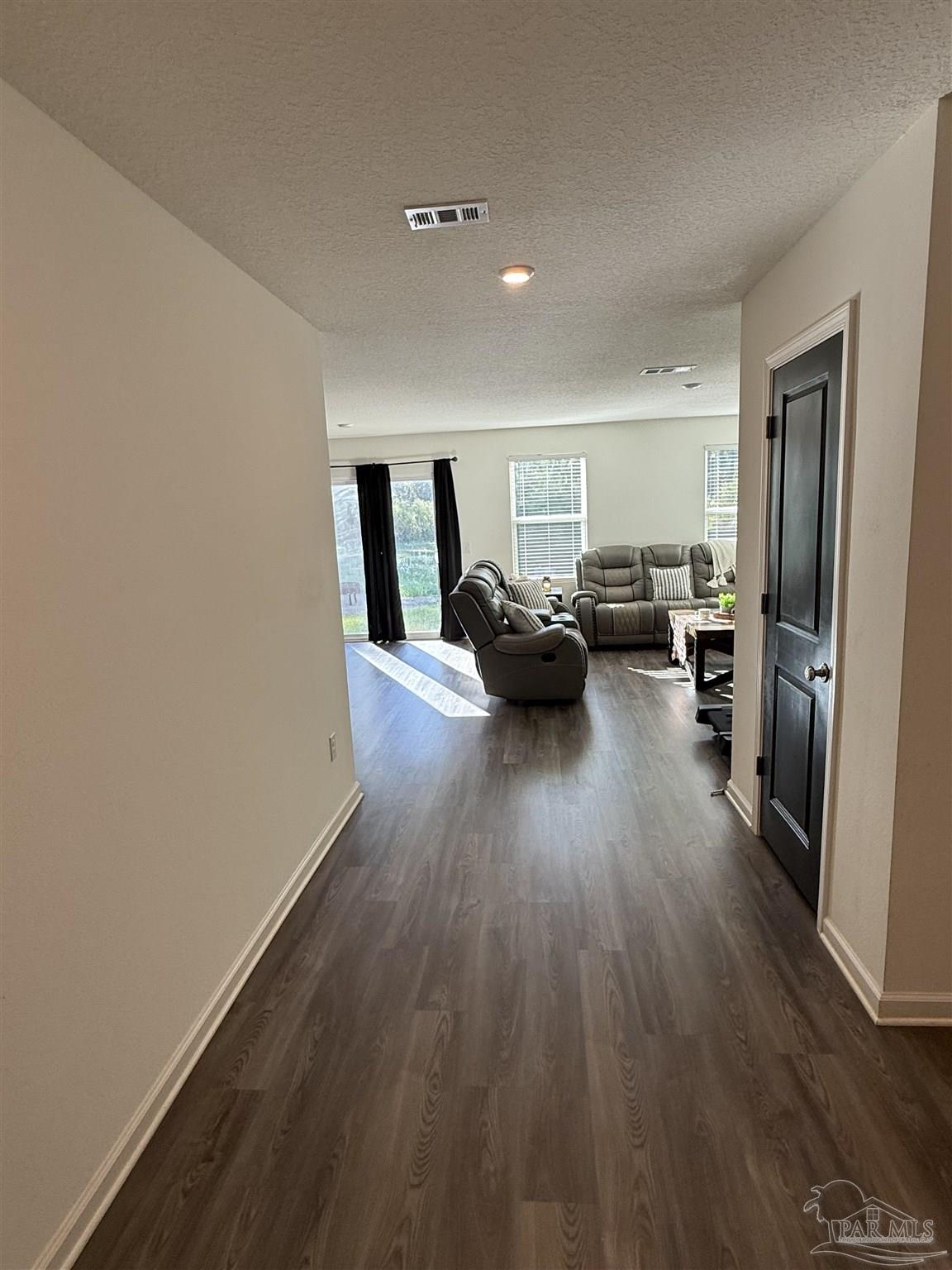 9279 3 Hollow Road Jay, FL 32565 - Photo 13 of 42 a living room with furniture and a wooden floor