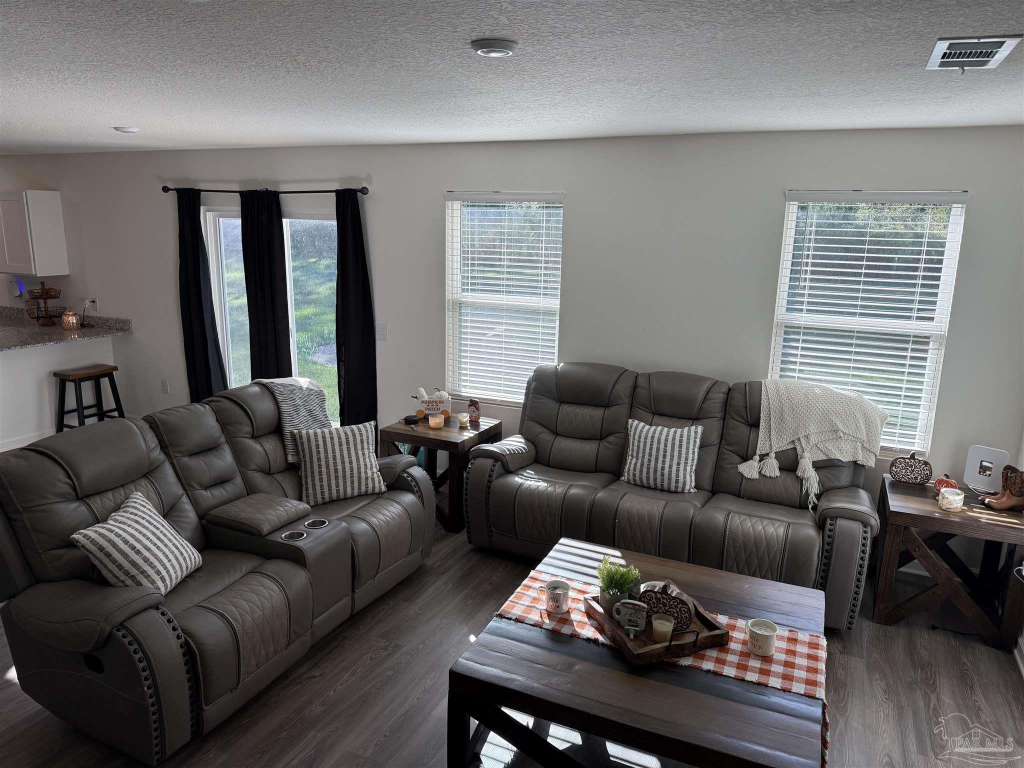 9279 3 Hollow Road Jay, FL 32565 - Photo 17 of 42 a living room with furniture and a window