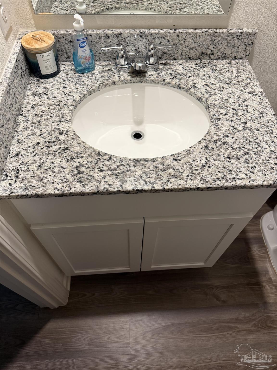 9279 3 Hollow Road Jay, FL 32565 - Photo 19 of 42 a bathroom with a granite countertop sink and a white stove