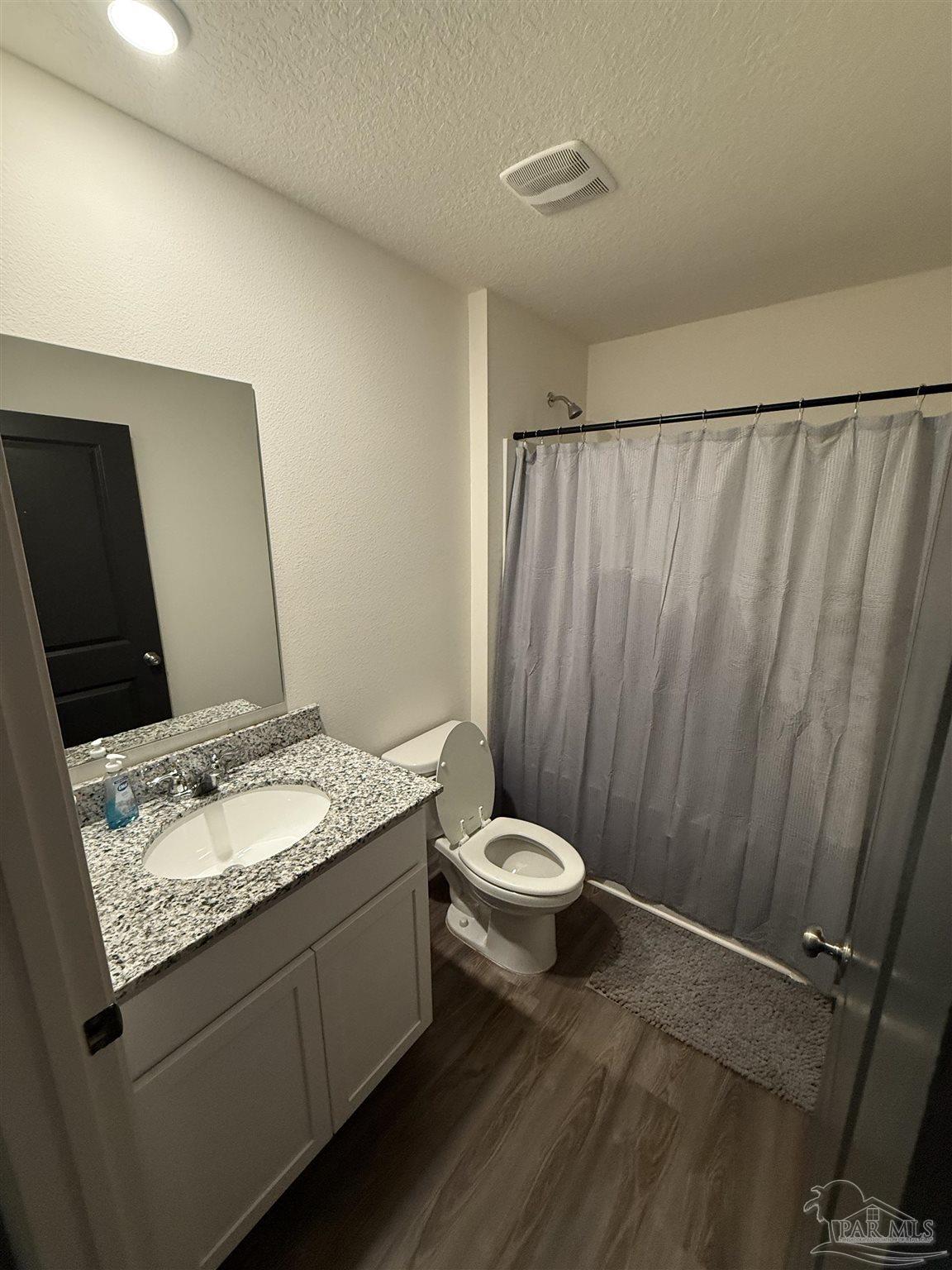 9279 3 Hollow Road Jay, FL 32565 - Photo 20 of 42 a bathroom with a granite countertop sink and a mirror