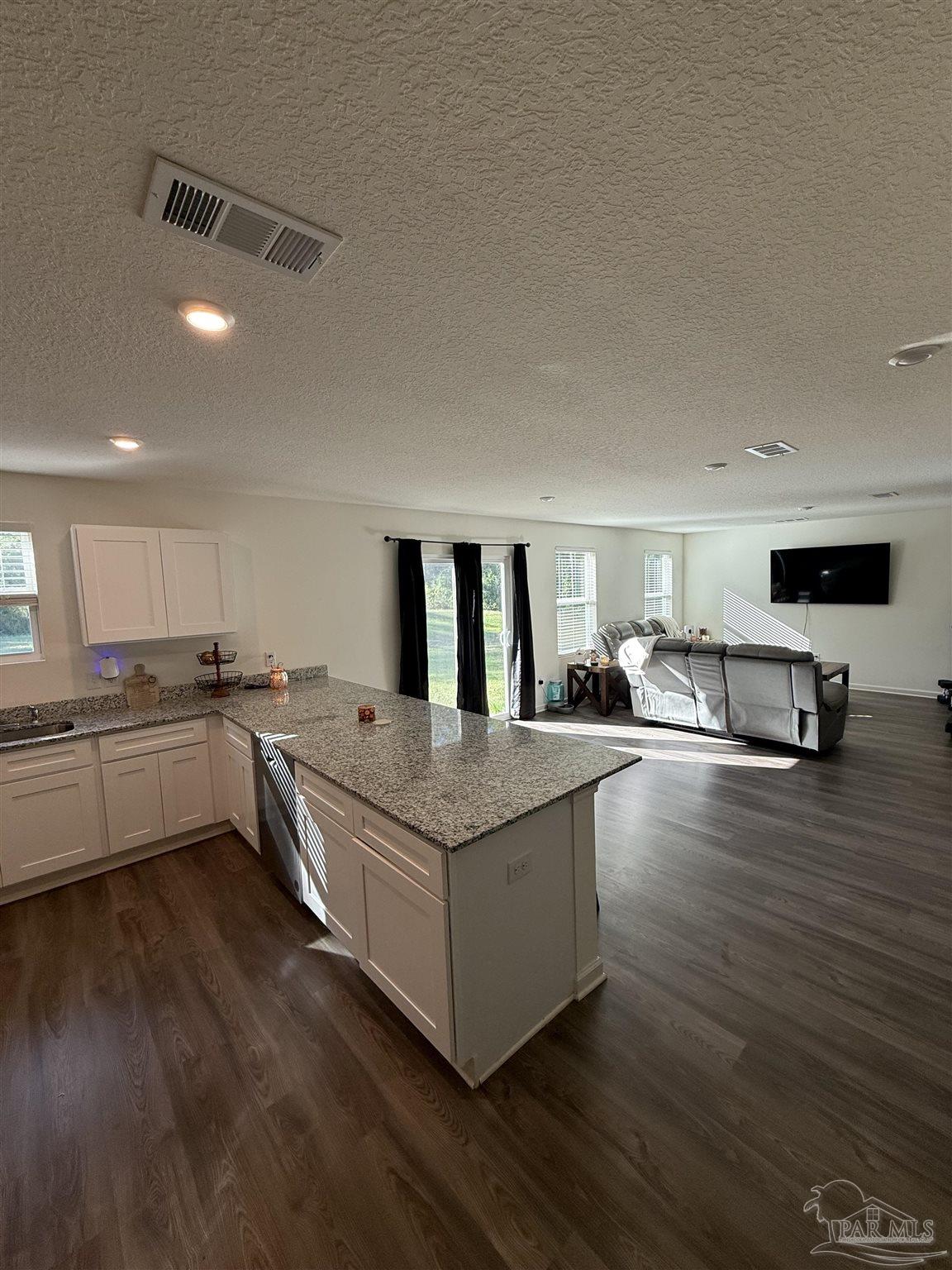 9279 3 Hollow Road Jay, FL 32565 - Photo 2 of 42 a living room with furniture and kitchen view