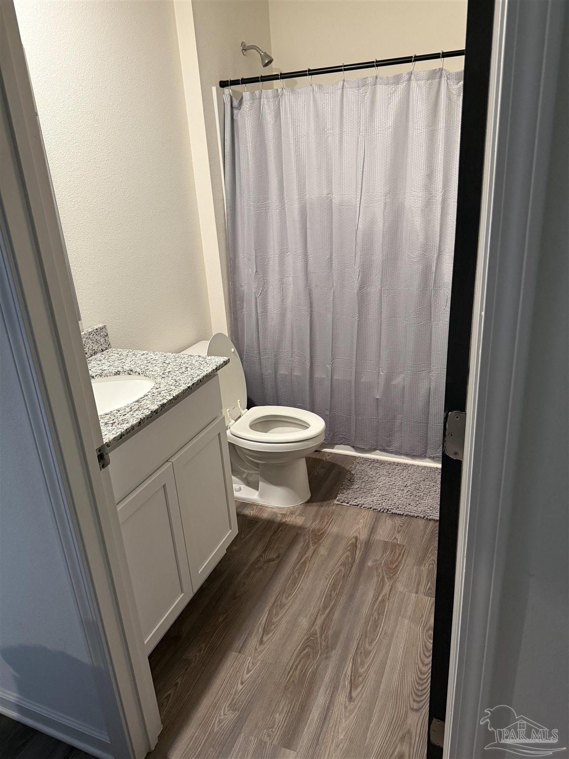 9279 3 Hollow Road Jay, FL 32565 - Photo 21 of 42 a bathroom with a granite countertop sink and a mirror