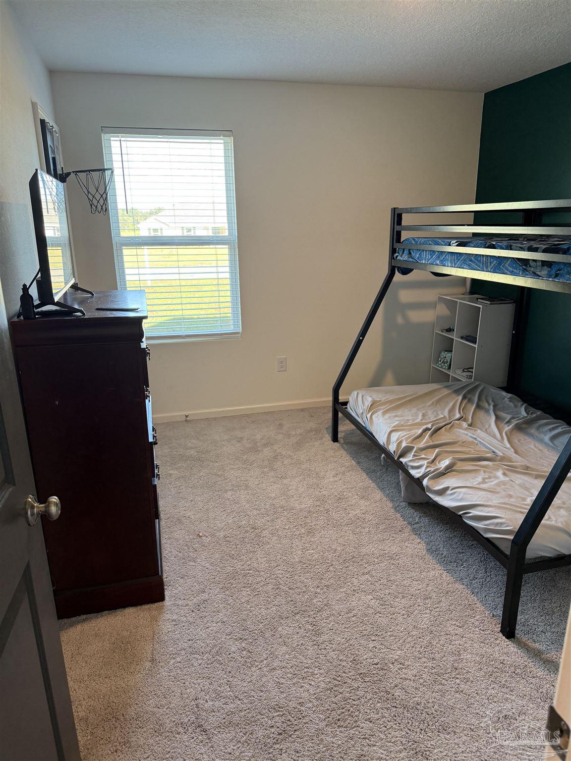 9279 3 Hollow Road Jay, FL 32565 - Photo 25 of 42 a bedroom with a bed and window