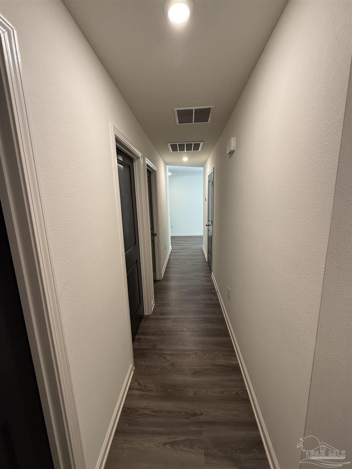 9279 3 Hollow Road Jay, FL 32565 - Photo 26 of 42 a view of hallway with wooden floor
