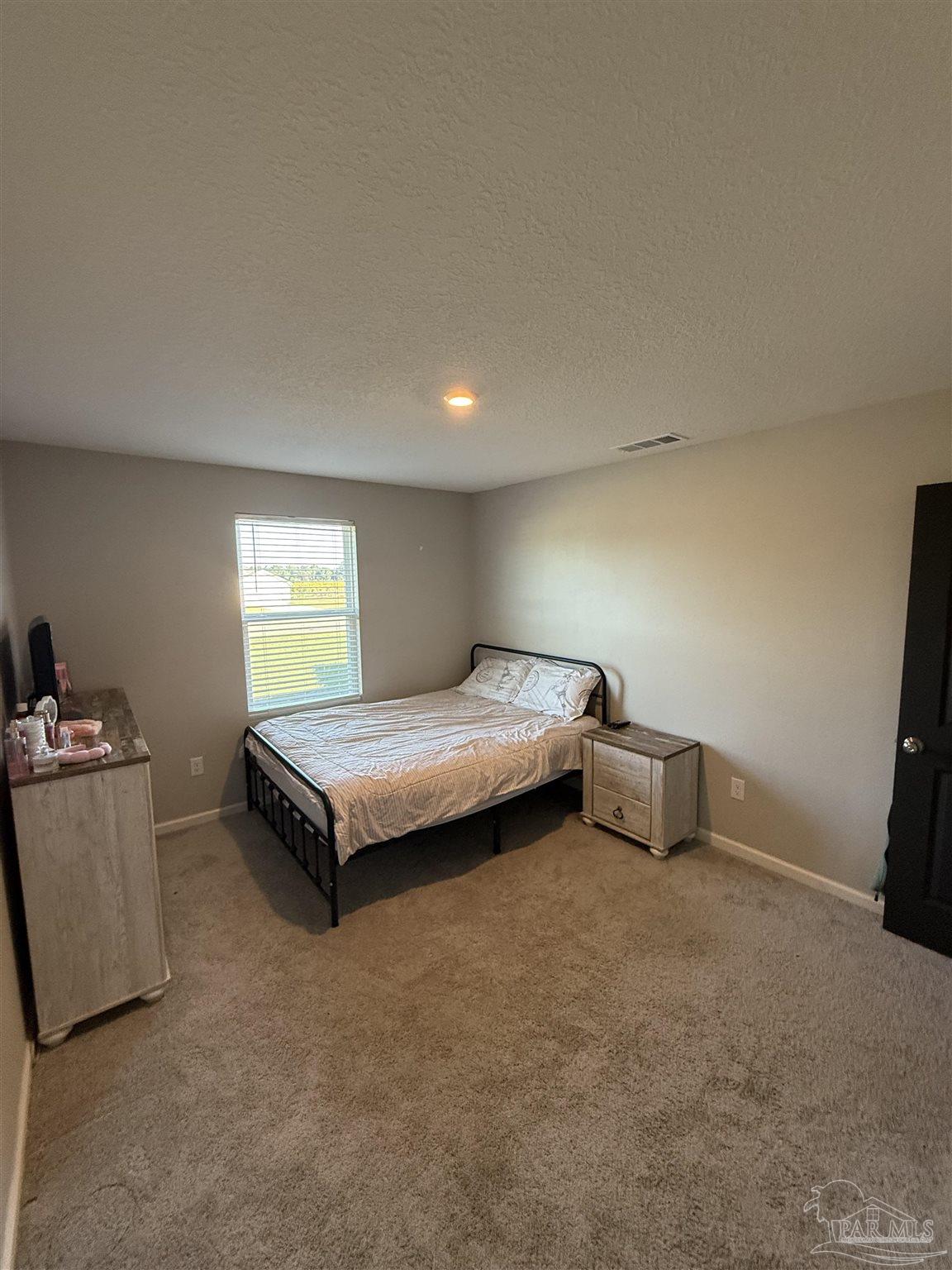 9279 3 Hollow Road Jay, FL 32565 - Photo 31 of 42 a bedroom with a bed and a window