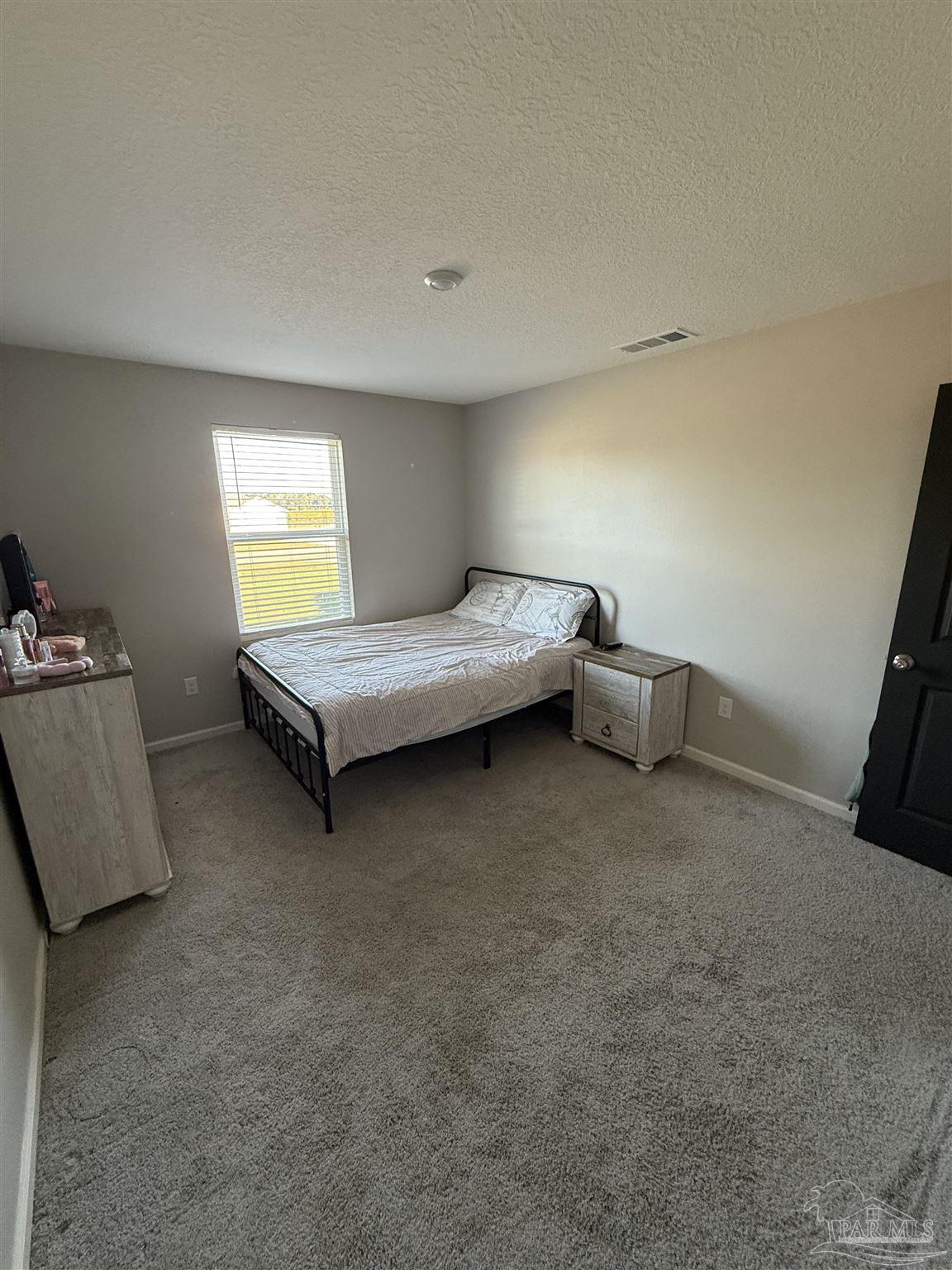 9279 3 Hollow Road Jay, FL 32565 - Photo 34 of 42 a living room with furniture and a couch