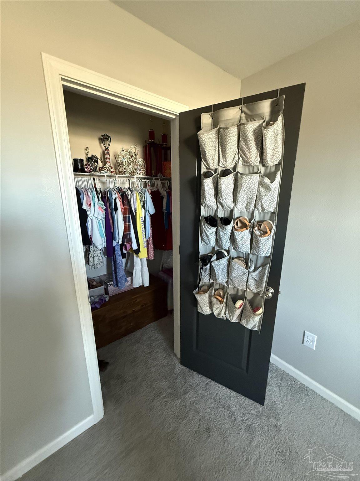 9279 3 Hollow Road Jay, FL 32565 - Photo 35 of 42 a view of a closet with storage