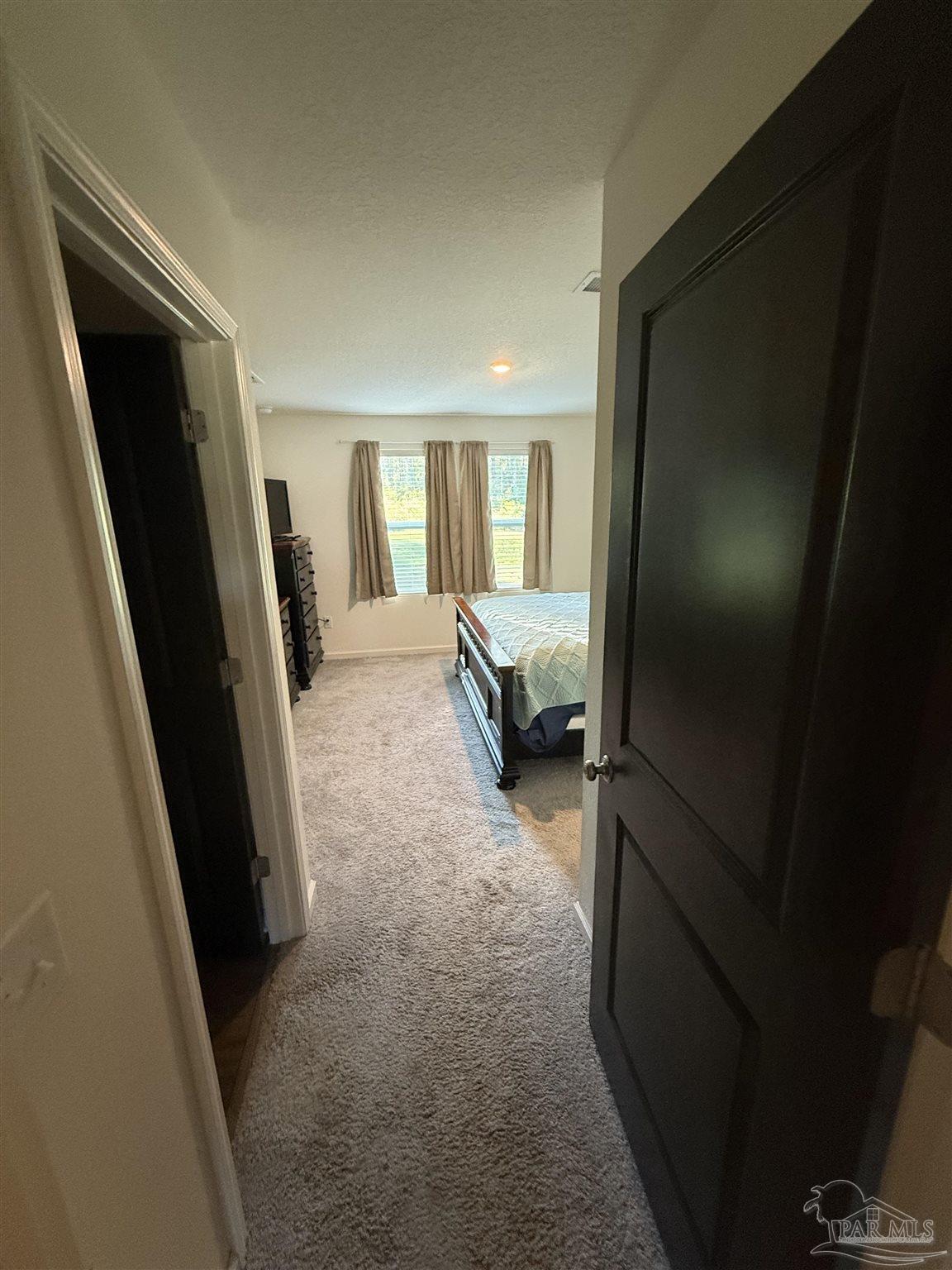 9279 3 Hollow Road Jay, FL 32565 - Photo 39 of 42 a view of hallway with furniture and a window