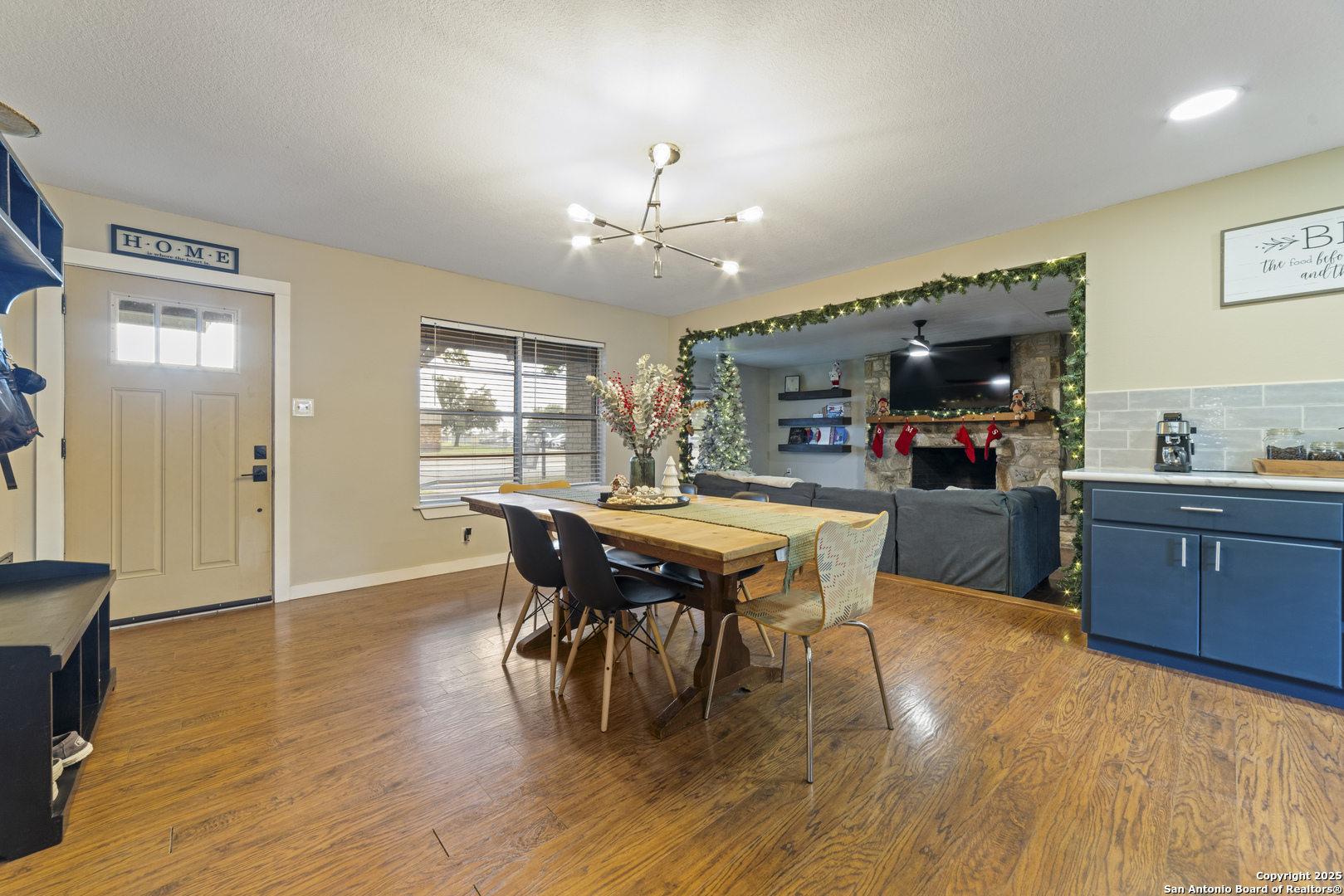 1706 24th Street Hondo, TX 78861 - Photo 11 of 40 a view of a dining room with furniture and wooden floor