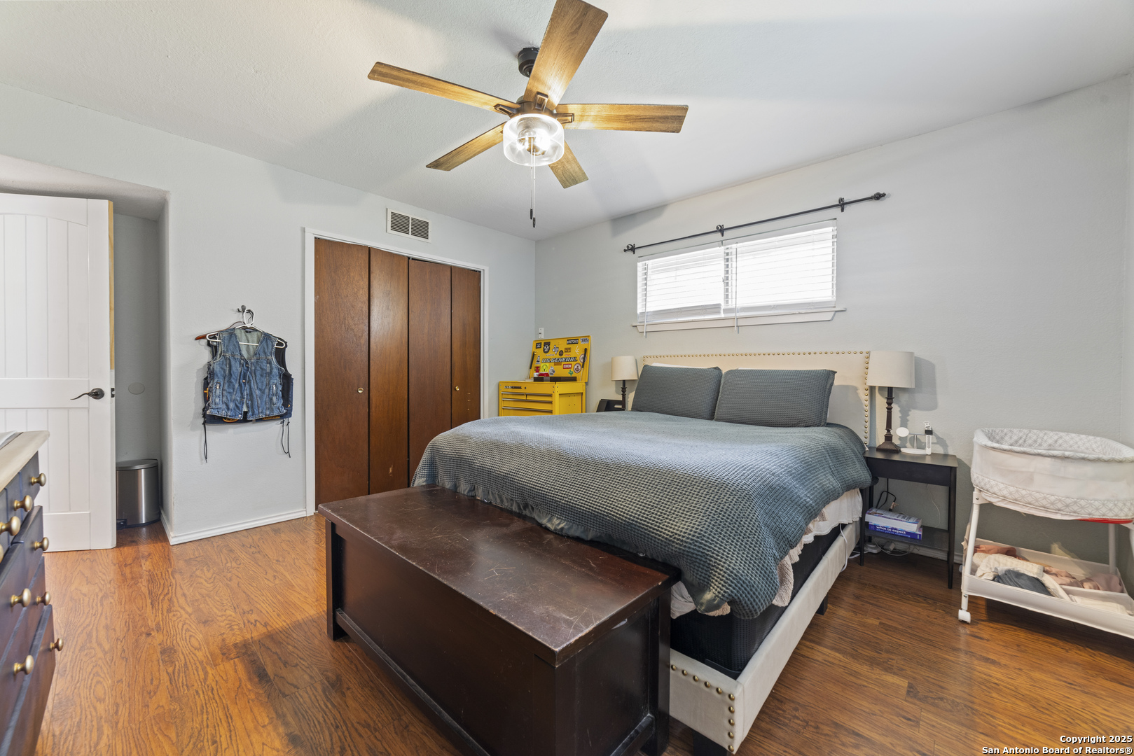 1706 24th Street Hondo, TX 78861 - Photo 20 of 40 a bedroom with a bed and wooden floor
