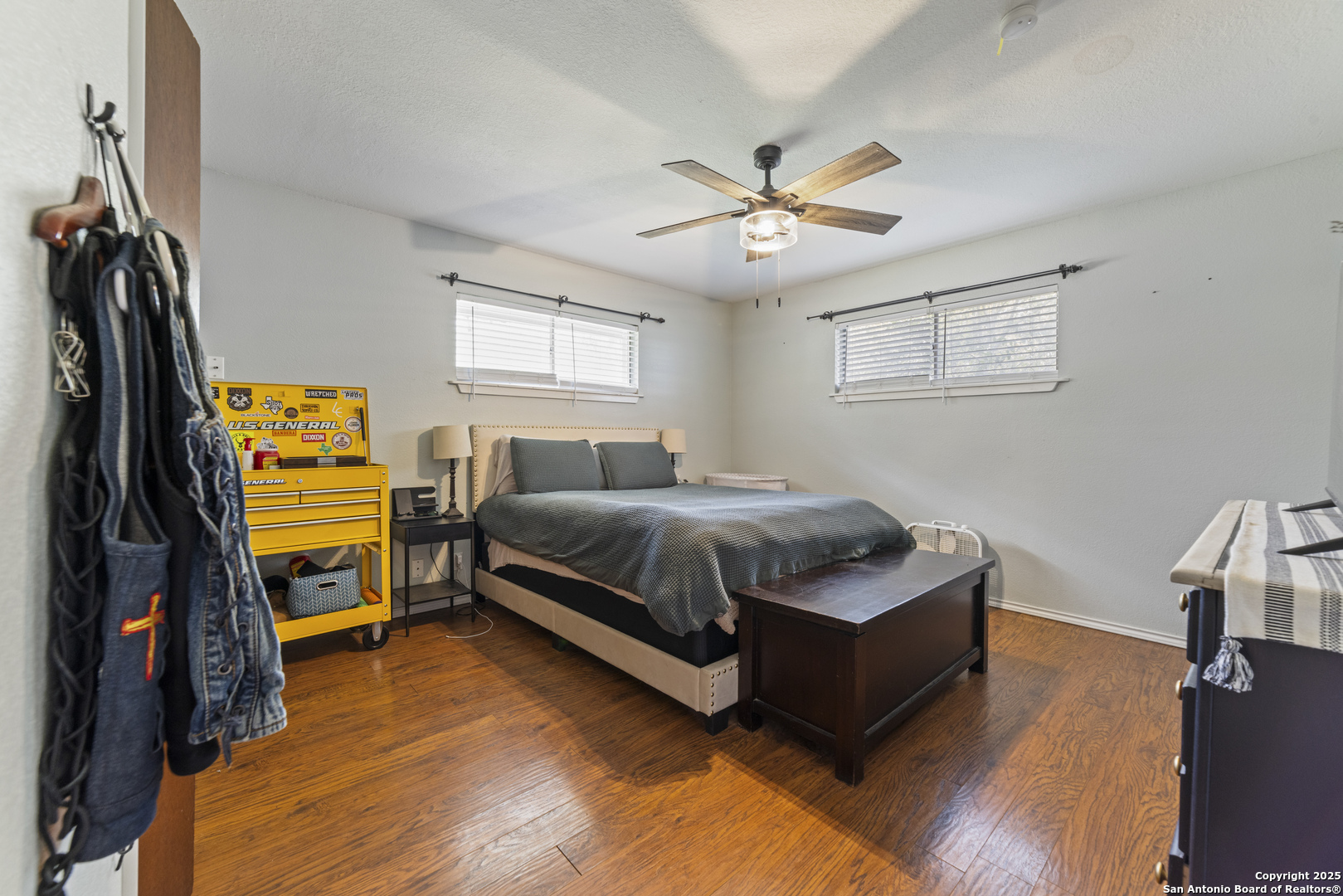 1706 24th Street Hondo, TX 78861 - Photo 21 of 40 a bedroom with a bed and a flat tv screen on the dresser
