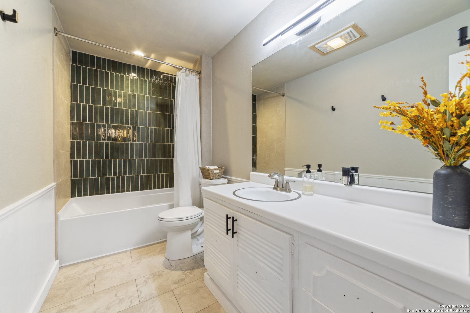 1706 24th Street Hondo, TX 78861 - Photo 22 of 40 a bathroom with a double vanity sink toilet and shower
