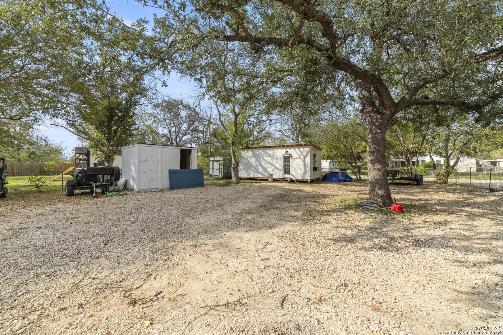 1706 24th Street Hondo, TX 78861 - Photo 25 of 40 a view of street with large trees