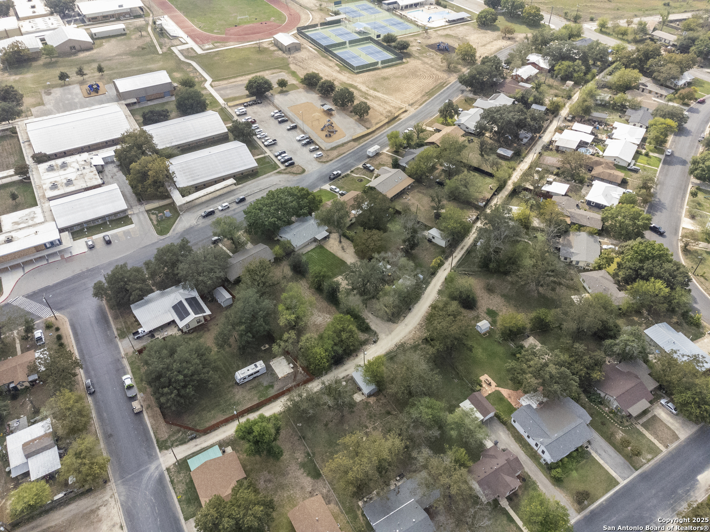 1706 24th Street Hondo, TX 78861 - Photo 36 of 40 an aerial view of residential houses with yard