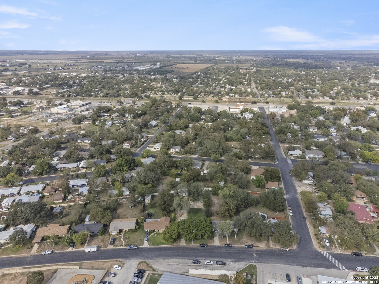 1706 24th Street Hondo, TX 78861 - Photo 38 of 40 an aerial view of residential houses with outdoor space and trees