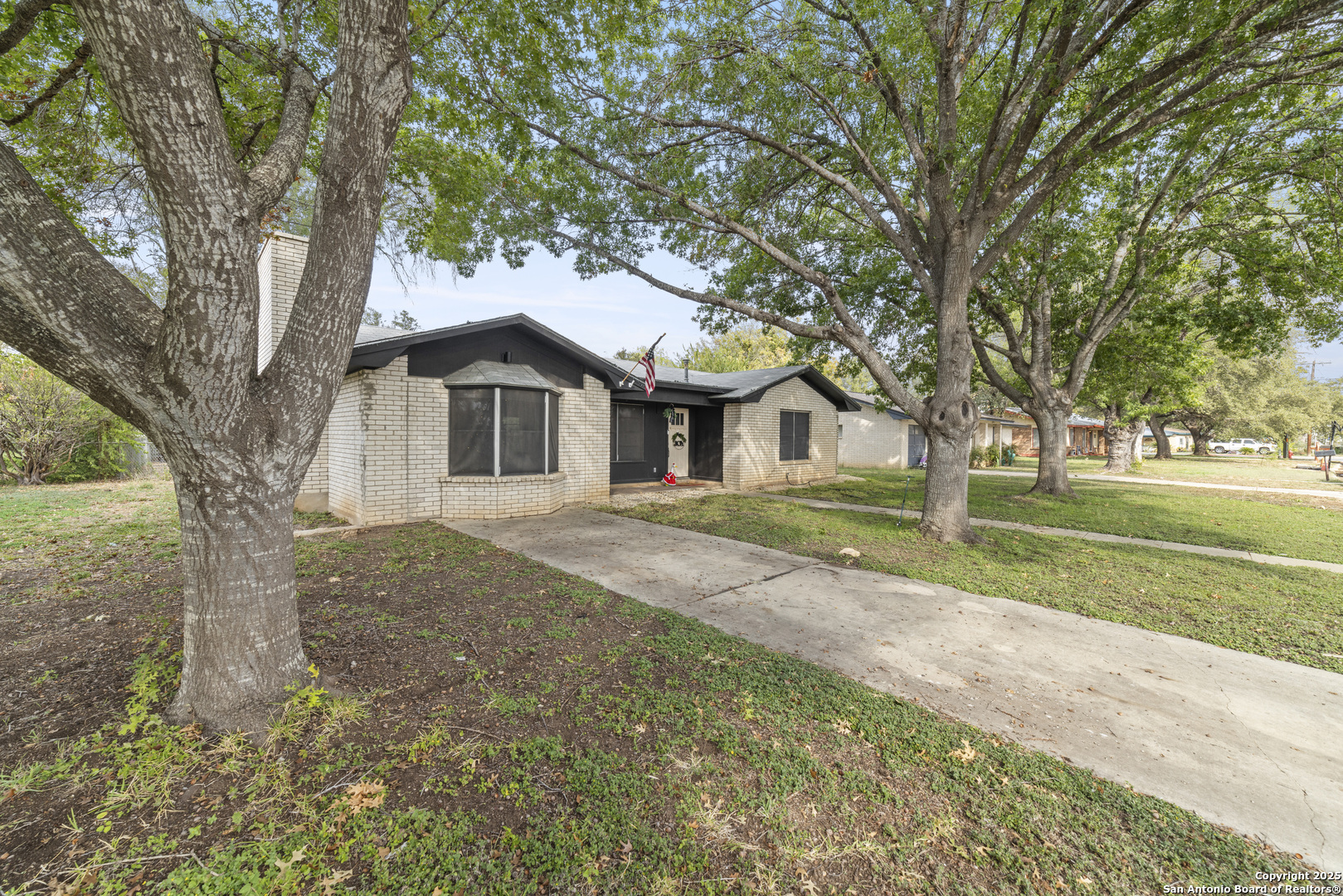 1706 24th Street Hondo, TX 78861 - Photo 4 of 40 a front view of a house with a yard