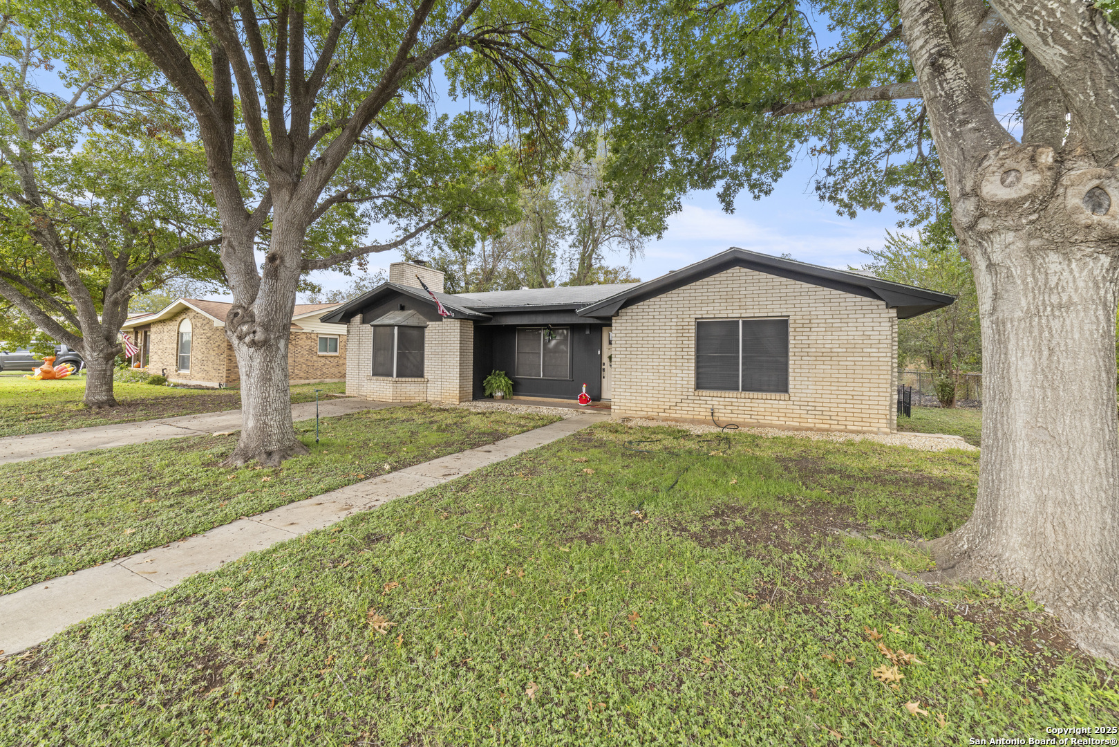 1706 24th Street Hondo, TX 78861 - Photo 6 of 40 a front view of a house with yard and green space