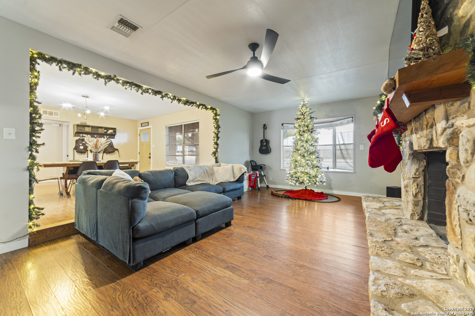 1706 24th Street Hondo, TX 78861 - Photo 9 of 40 a living room with furniture and a wooden floor