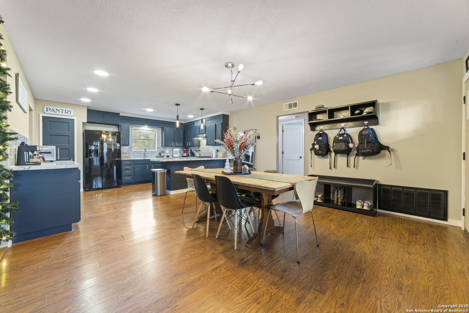 1706 24th Street Hondo, TX 78861 - Photo 10 of 40 a view of a dining room with furniture and chandelier