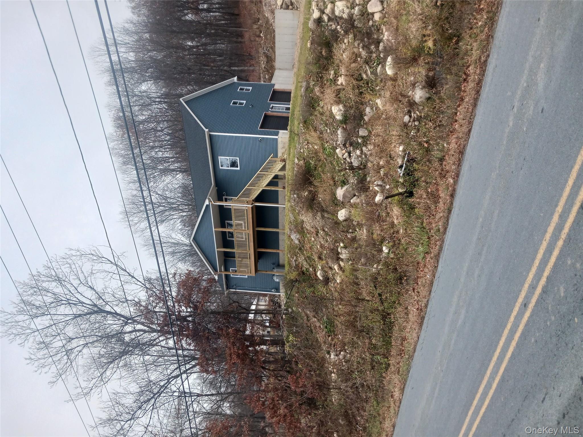207 Roosa Gap Road Bloomingburg, NY 12721 - Photo 1 of 10 a front view of a house with a yard