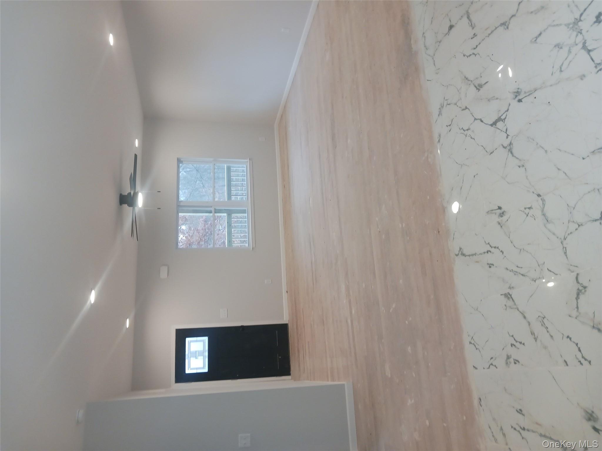 207 Roosa Gap Road Bloomingburg, NY 12721 - Photo 2 of 10 a view of an empty room and a window