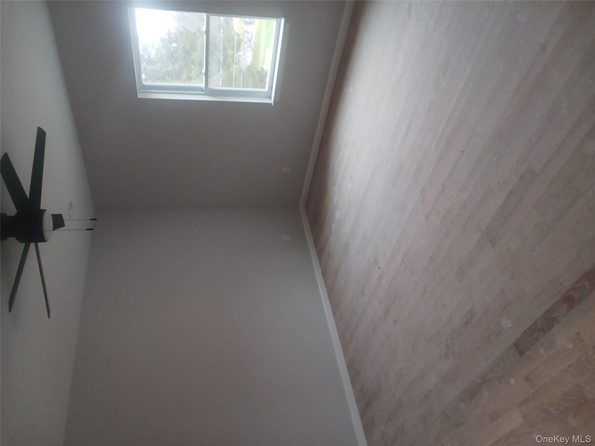 207 Roosa Gap Road Bloomingburg, NY 12721 - Photo 7 of 10 an empty room with a window