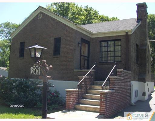 241 New Road Monmouth Junction, NJ 08852 - Photo 1 of 1 a front view of a house with a yard