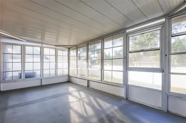 a view of an empty room and window