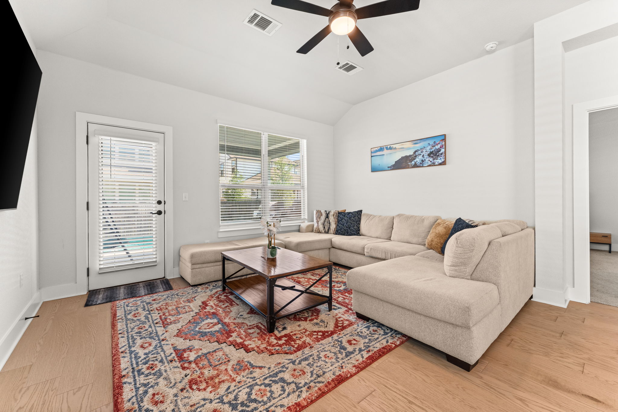 8512 McKamy Drive Austin, TX 78744 - Photo 12 of 28 High ceilings and large windows create a bright, airy atmosphere.