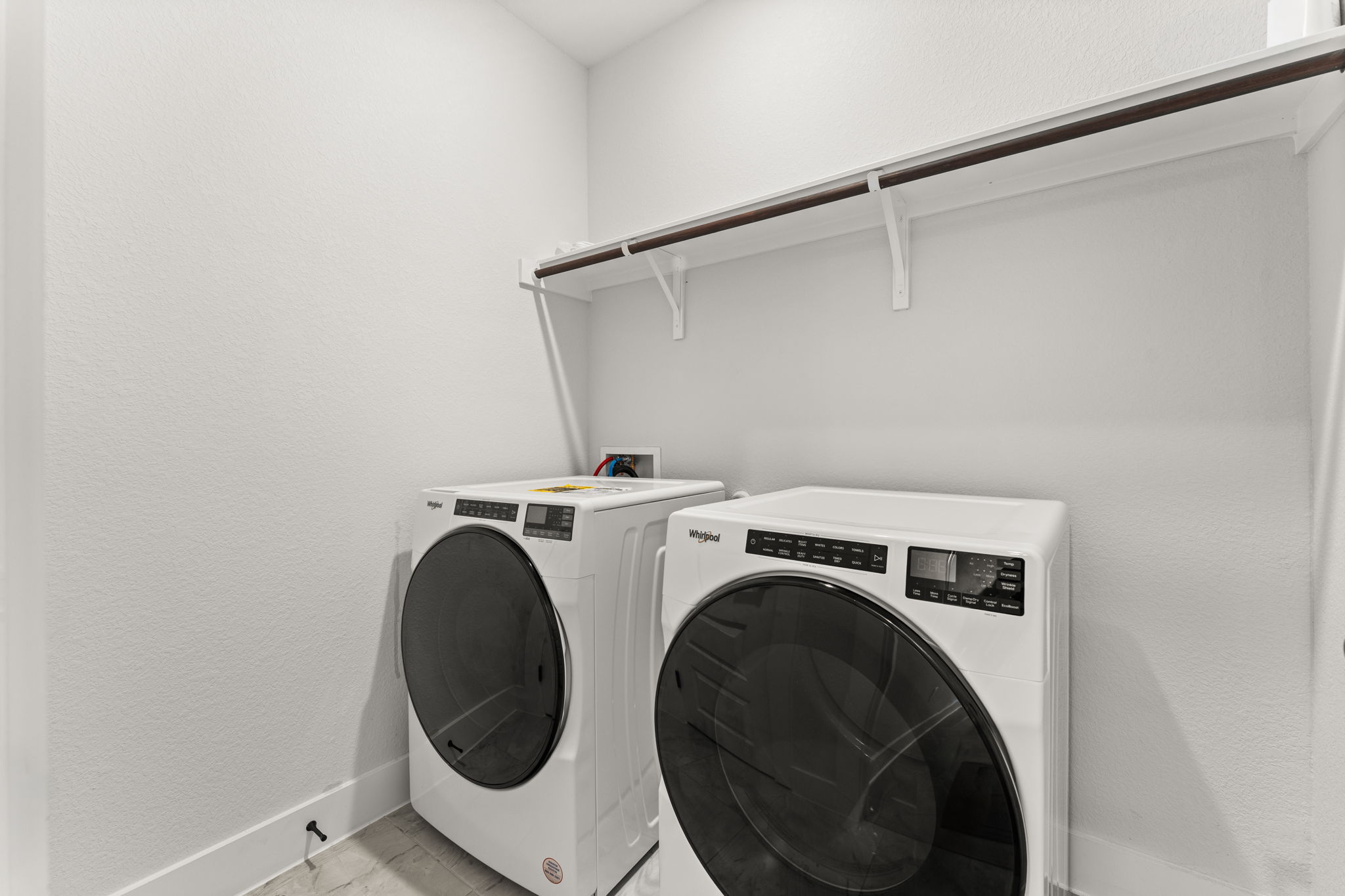 8512 McKamy Drive Austin, TX 78744 - Photo 18 of 28 A dedicated laundry room provides extra storage and everyday convenience.