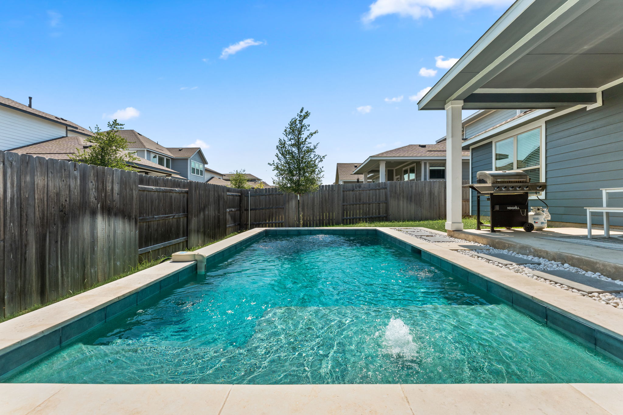 8512 McKamy Drive Austin, TX 78744 - Photo 2 of 28 Cool off and unwind in your private sparkling pool.