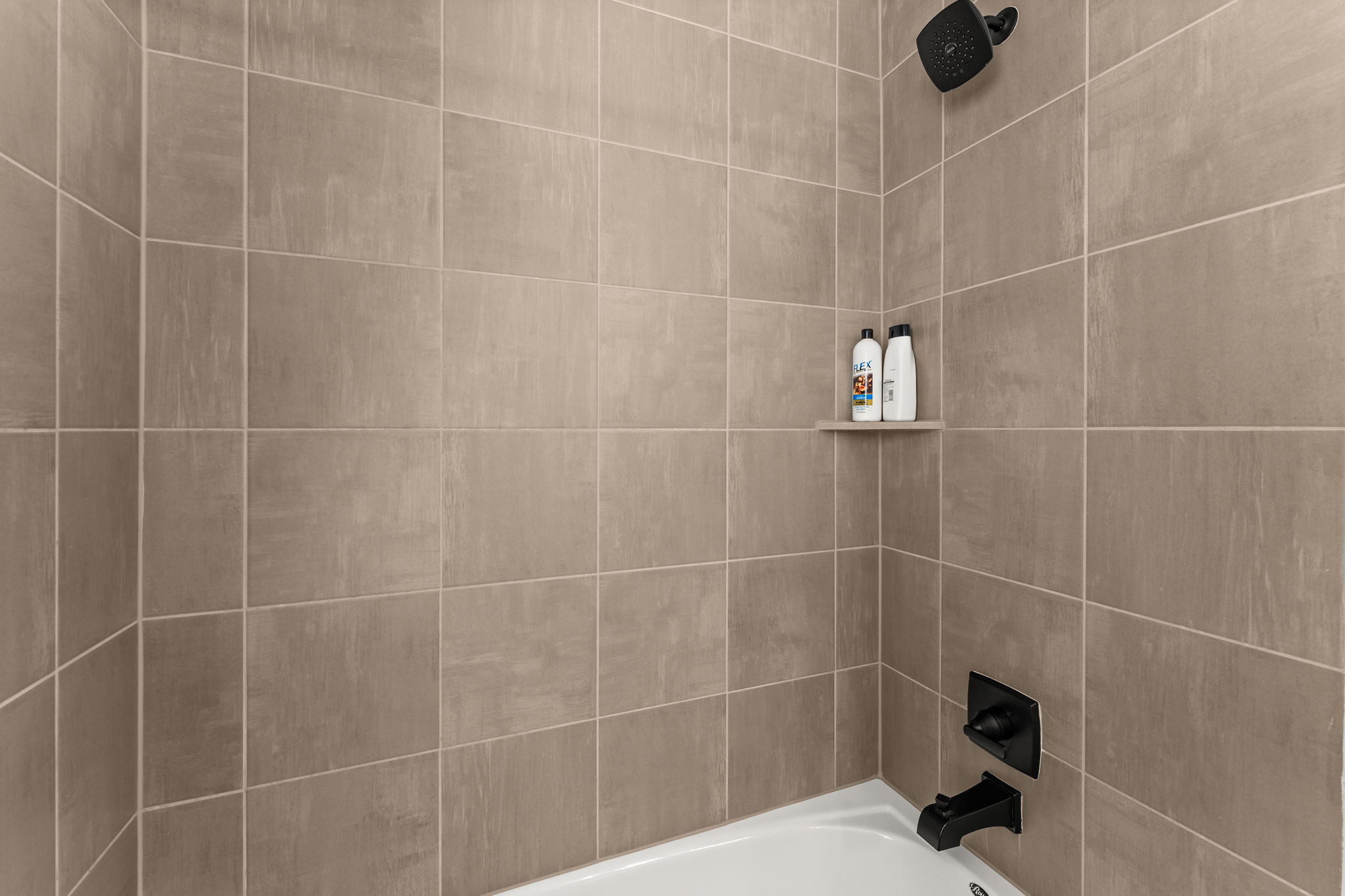 8512 McKamy Drive Austin, TX 78744 - Photo 23 of 28 Each guest bath offers functionality with sleek design touches.