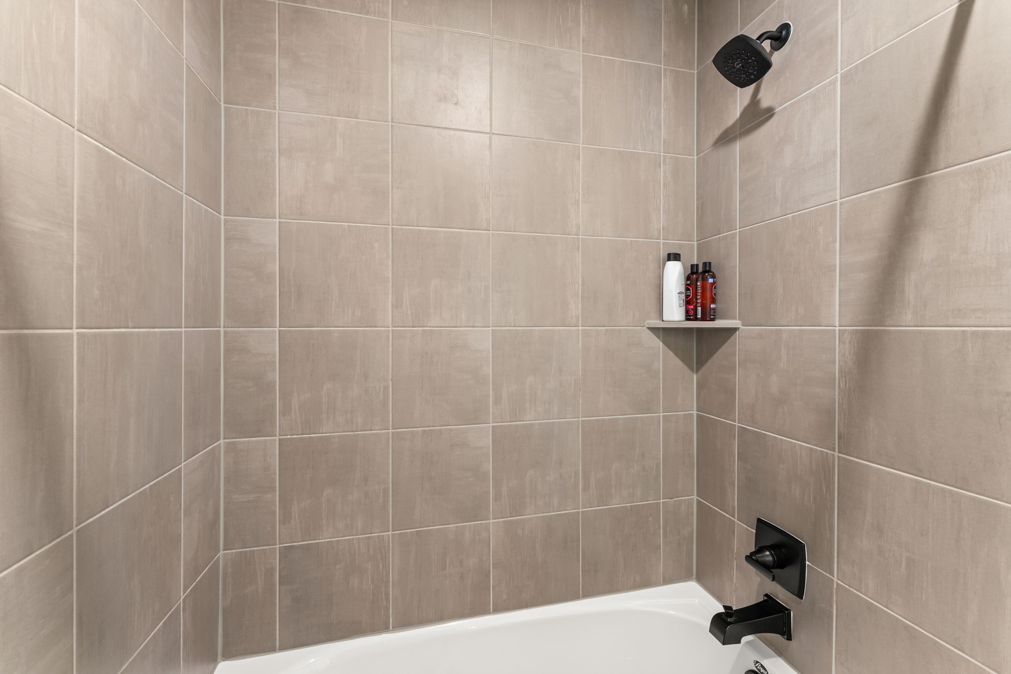 8512 McKamy Drive Austin, TX 78744 - Photo 26 of 28 With clean lines and quality finishes, the guest bathrooms are move-in ready.