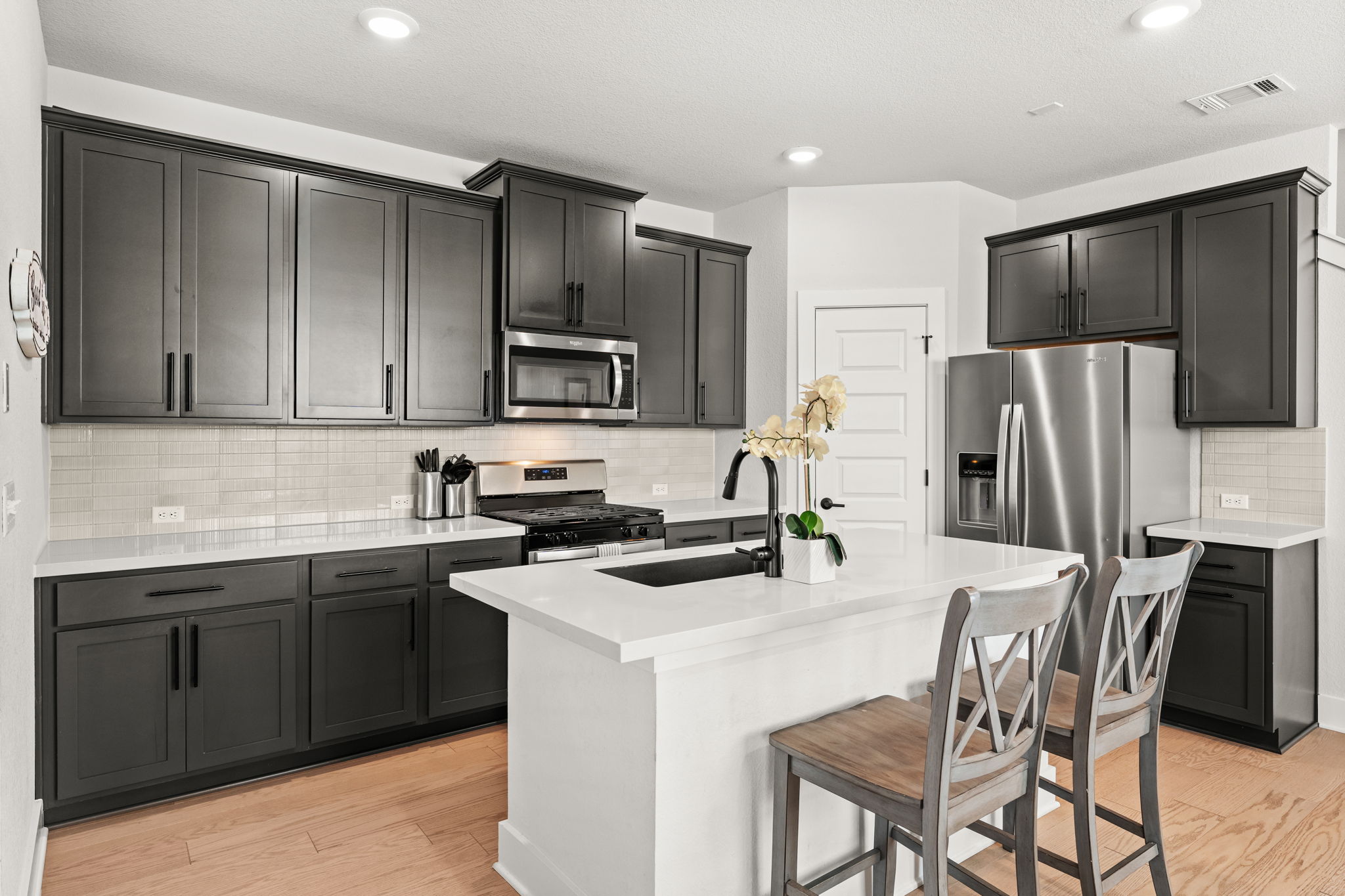 8512 McKamy Drive Austin, TX 78744 - Photo 9 of 28 This kitchen’s sleek design combines beauty with functionality.