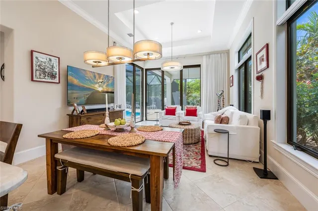 a very nice looking dining room with a large table and chairs