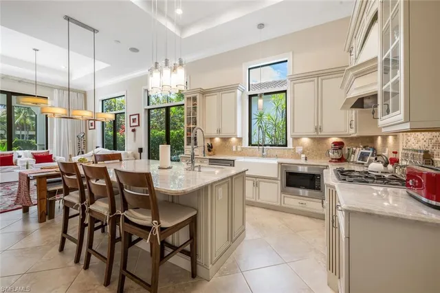 a kitchen with lots of counter top space and appliances