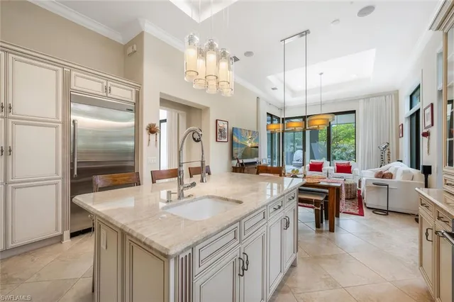 a kitchen with a sink stove and refrigerator