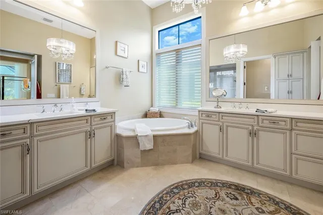 a spacious bathroom with a granite countertop sink mirror and a
